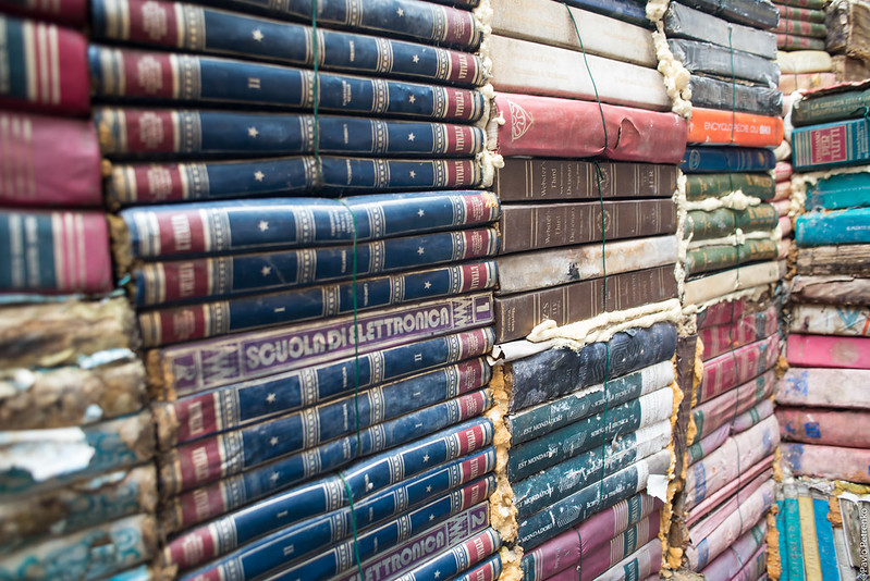 Stacks of old books arranged vertically